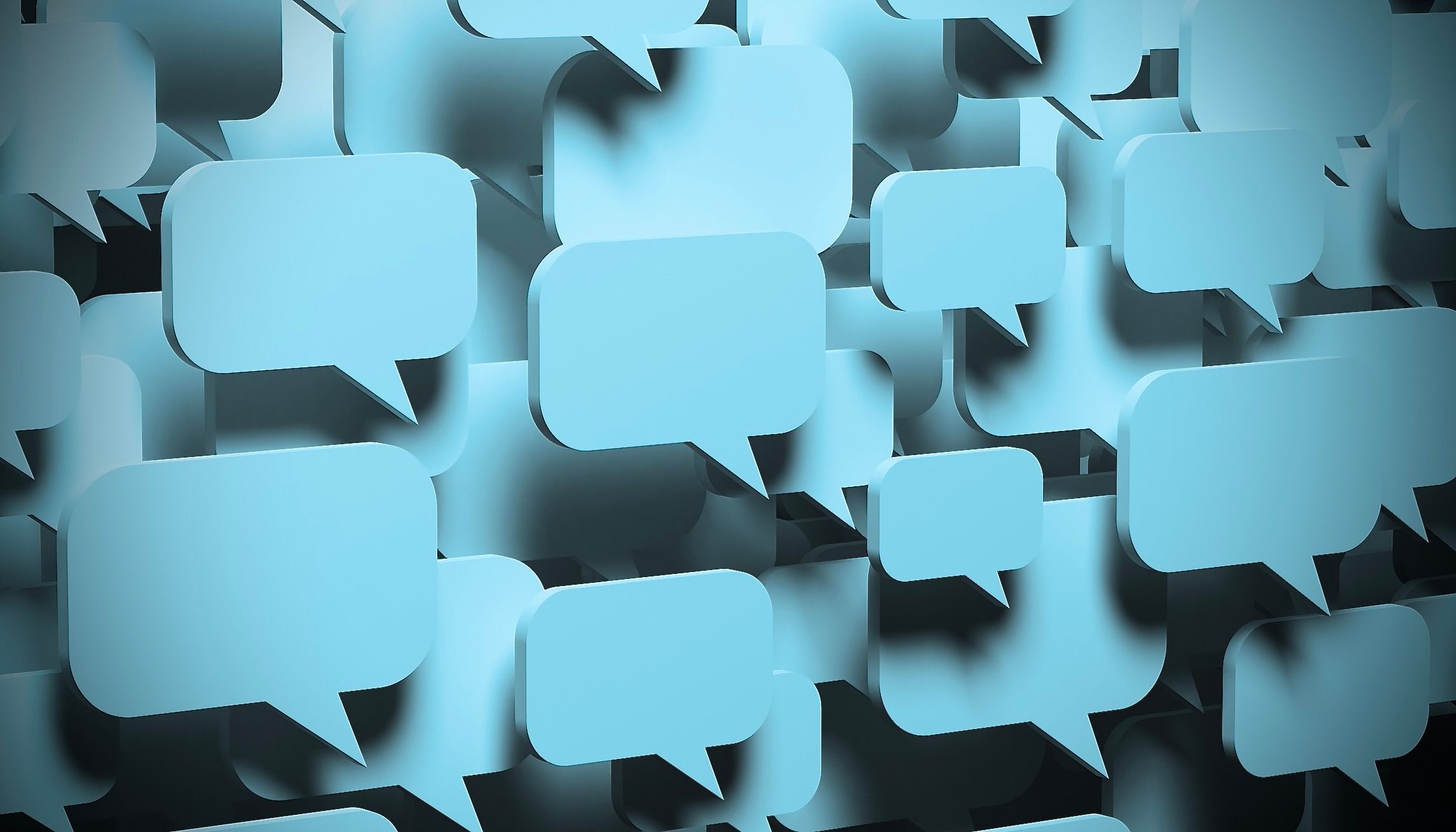 Une image de bulles de dialogue vides, pâles et bleues, se chevauchant et flottant en cluster.